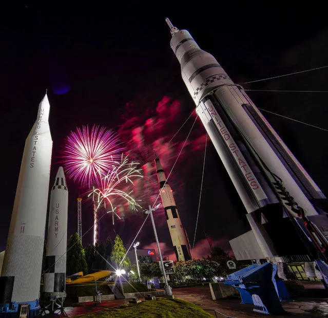 Fireworks explode during Fourth of July celebrations at the U.S. Space & Rocket Center in Huntsville, Ala., Tuesday, July 4, 2017. (Photo by Bob Gathany/AL.com via AP Photo)