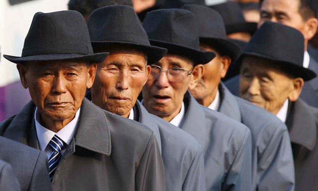 North Korean family members arrive to meet with their South Korean family members during a reunion for separated families at Mount Kumgang resort, North Korea, October 21, 2015. Nearly 400 South Koreans crossed the heavily armed border into North Korea on Tuesday to be reunited, in an outpouring of emotions and tears, with family members separated for more than six decades since the 1950-53 Korean War. (Photo by Reuters/Yonhap)