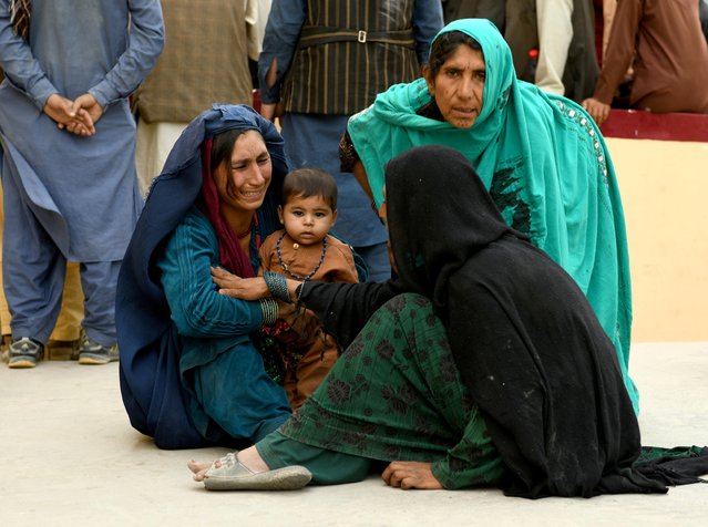 Relatives react in front of a hospital, where their family member has been transferred for treatment after a truck bomb blast in Balkh province, in Mazar-i-Sharif, Afghanistan on August 25, 2020. At least four people were killed and 41 wounded, most of them civilians, after a Taliban suicide bomber detonated a truck loaded with explosives near a military base in Balkh, northern Afghanistan. (Photo by Reuters/Stringer)
