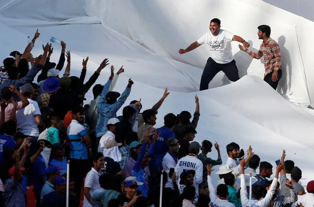 Indian fans react in the stands during the cricket match between India and Australia, in Ahmedabad on March 10, 2023. (Photo by Amit Dave/Reuters)