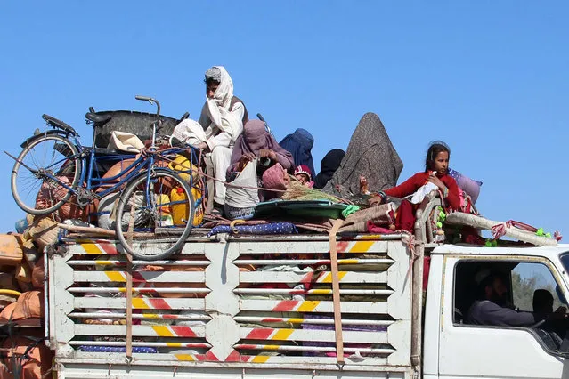 Afghans flee their villages after fighting intensified between Taliban militants and security forces, in Lashkargah, the provincial capital of restive Helmand province, Afghanistan, 12 October 2020. The clashes comes as both the Taliban and Afghan government are in the process of taking the peace talks forward in Doha, Qatar. (Photo by Watan Yar/EPA/EFE)