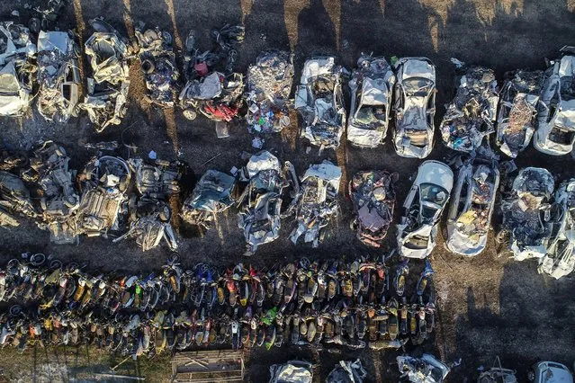 An aerial view of parking lot with vehicles removed from the wreckage in quake-hit Adiyaman after 7.7 and 7.6 magnitude earthquakes hit multiple provinces of Turkiye, on March 9, 2023. Vehicles, almost all of which are damaged, are kept in three designated parking lots in the city. Vehicles that have been scrapped in the parking lots and whose license plate cannot be determined are identified according to their vin numbers and licenses and given to their owners by a report. On Feb. 06, a strong 7.7 earthquake, centered in the Pazarcik district, jolted Kahramanmaras and strongly shook several provinces, including Gaziantep, Sanliurfa, Diyarbakir, Adana, Adiyaman, Malatya, Osmaniye, Hatay, Kilis, and Elazig. Later, at 1.24 p.m. (1024GMT), a 7.6 magnitude quake centered in Kahramanmaras' Elbistan district struck the region. (Photo by Ozkan Bilgin/Anadolu Agency via Getty Images)