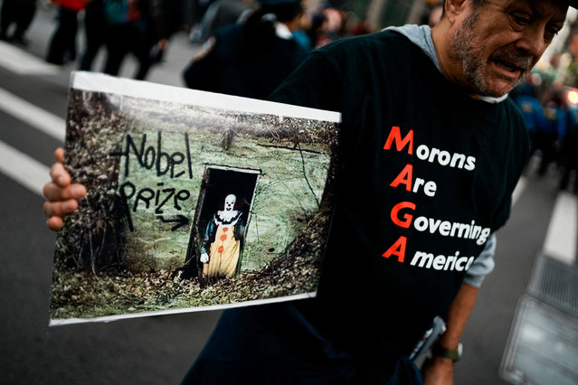 People attend a “No Kings” protest against U.S. President Donald Trump's policies, in Times Square in New York City, U.S., October 18, 2025. (Photo by Eduardo Munoz/Reuters)