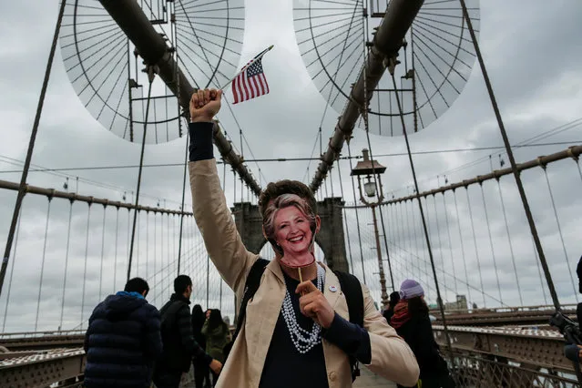 Supporters of U.S. Democratic presidential nominee Hillary Clinton take part in a march through the Brooklyn bridge in New York, U.S. October 22, 2016. (Photo by Eduardo Munoz/Reuters)
