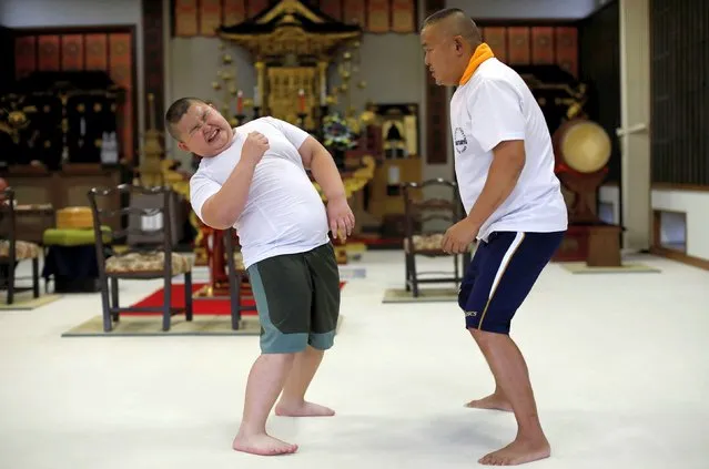 Kyuta Kumagai, 10, practices sumo with his father Taisuke, 50, during a one-on-one training session which his father organized at the Buddhist temple Joshin-ji in Tokyo, Japan, September 2, 2020. “I didn't teach him anything, he could do various things naturally”, said Taisuke, a former amateur sumo wrestler. “There is a talent for sumo and he has that talent”. (Photo by Kim Kyung-Hoon/Reuters)