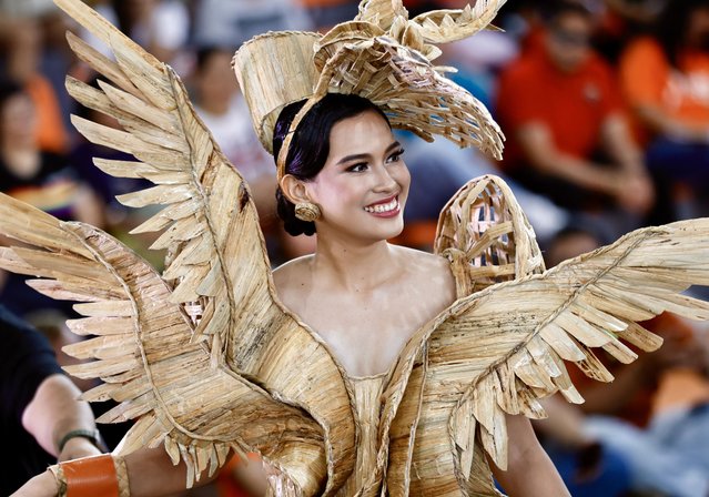 Irish Silades wears a gown made from dried water hyacinth stalks as she parades during the Water Lily Festival in Las Pinas city, Metro Manila, Philippines, 06 August 2024. The annual Water Lily Festival in Las Pinas city was declared by the Villar Foundation to highlight the transformation of water lilies from aquatic nuisances to valuable resources. Through the 'Water Lily Weaving Project', the foundation turns these plants into handicrafts, creating livelihoods and aiding community rehabilitation. During the festival, villagers parade in traditional costumes made from dried water lilies, showcasing the project's success and promoting the benefits of water lily-based livelihoods for local residents. (Photo by Francis R. Malasig/EPA)
