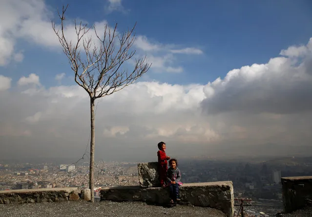 Children play near their house on a hilltop overlooking Kabul, Afghanistan March 14, 2018. (Photo by Mohammad Ismail/Reuters)