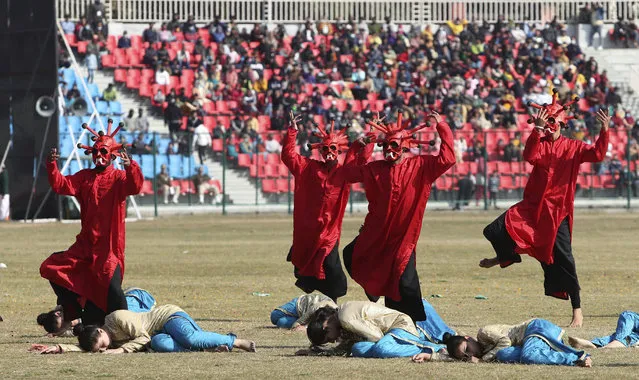 Artists dressed as the coronavirus dance during a Republic Day parade in Jammu, India, Tuesday, January 26, 2021. Republic Day marks the anniversary of the adoption of the country's constitution on Jan. 26, 1950. (Photo by Channi Anand/AP Photo)