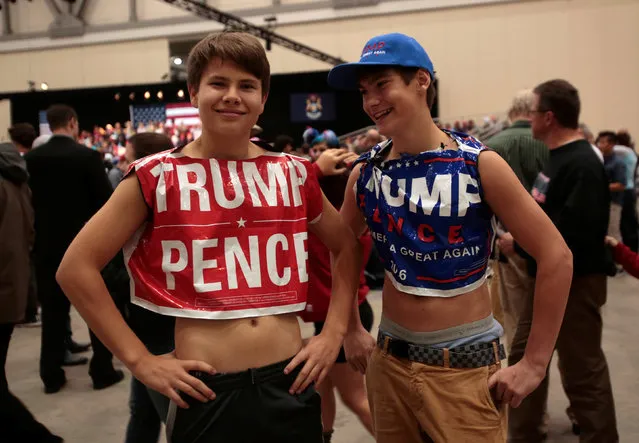 U.S. Republican presidential nominee Donald Trump supporters Mick Ventocilla (L) and Nick Giddings come dressed as “campaign lawn signs” to hear Trump speak at the Devos Place in Grand Rapids, Michigan November 7, 2016. (Photo by Rebecca Cook/Reuters)