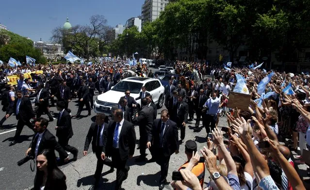 Argentina's President Mauricio Macri's car is surrounded by security as he leaves after being sworn-in to office at the Argentine Congress in Buenos Aires, December 10, 2015. (Photo by Martin Acosta/Reuters)