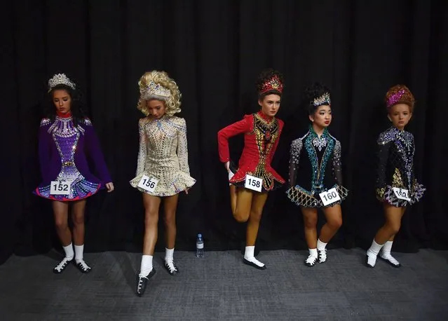 Dancers wait to be called to the stage during the opening day of the World Irish Dancing Championships at the Waterfront Hall on April 10, 2022 in Belfast, Northern Ireland. The championships are taking place for the first time in two years due to Covid-19 restrictions with Belfast hosting the 50th World Irish Dancing Championships. More than 3,500 competitors from across the globe expected to take part in the week-long competition. (Photo by Charles McQuillan/Getty Images)