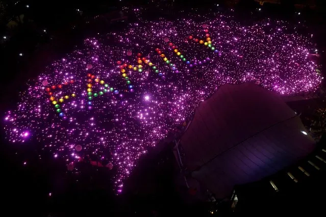 Attendees form the pink dot at the Pink Dot rally in Singapore on June 24, 2023. (Photo by Edgar Su/Reuters)