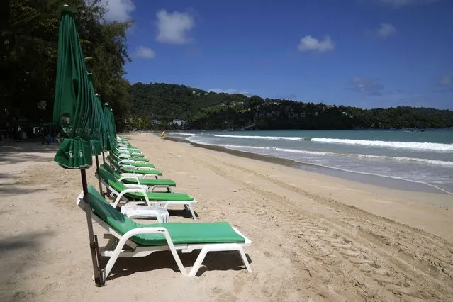 Empty beach chairs line the empty tourist beach of Patong on Phuket, southern Thailand, Monday, June 28, 2021. (Photo by Sakchai Lalit/AP Photo)