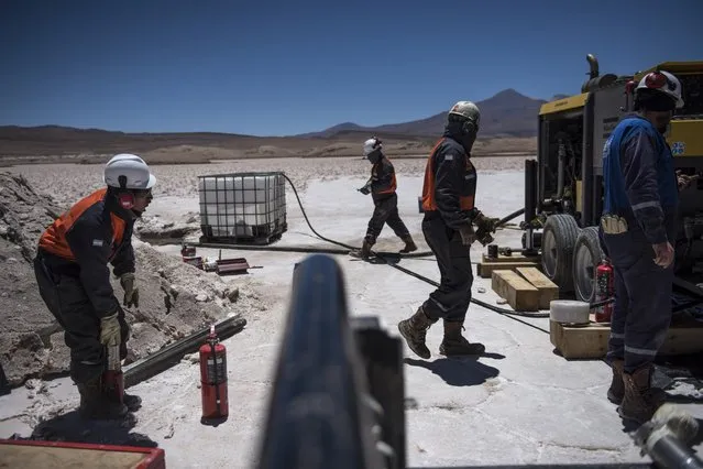 Workers with Millenial Lithium drill into the Pastos Grandes Salar in their search for optimal areas to gather the metal. Battery grade lithium, used for mobile phones and electric vehicles, can command prices as high as  US$20,000 a ton. Many critics say environmental costs, mainly the draining of aquifers, some that took over 500,000 years to collect, will decimate the ecosystem. (Photo by Michael Robinson Chavez/The Washington Post)