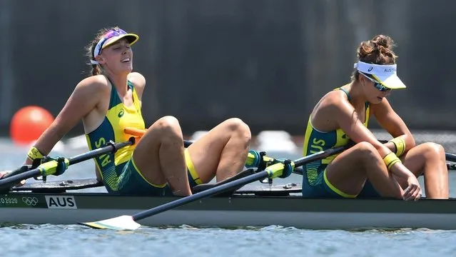 (L-R) Australia's Amanda Bateman and Australia's Tara Rigney react after competing and finishing in the women's double sculls rowing heats during the Tokyo 2020 Olympic Games at the Sea Forest Waterway in Tokyo on July 23, 2021. (Photo by Piroschka van de Wouw/Reuters)