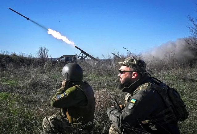 Ukrainian servicemen fire a Partyzan small multiple rocket launch system toward Russian troops near a front line, amid Russia's attack on Ukraine, in Zaporizhzhia region, Ukraine on November 7, 2023. (Photo by Reuters/Stringer)