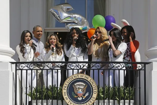 U.S. President Barack Obama (2nd L) and first lady Michelle Obama (R) sing Happy Birthday with singing group Fifth Harmony to mark the fifth anniversary of the first lady's “Let's Move!” children health initiative during the annual Easter Egg Roll at the White House in Washington April 6, 2015. (Photo by Jonathan Ernst/Reuters)