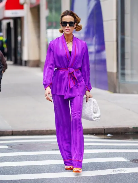 Kate Beckinsale dazzles in purple while shopping on 5th Avenue in New York City on July 21, 2021. The 47 year old English actress carried a woven handbag and wore a belted blazer, matching trousers, and heels. (Photo by The Image Direct)