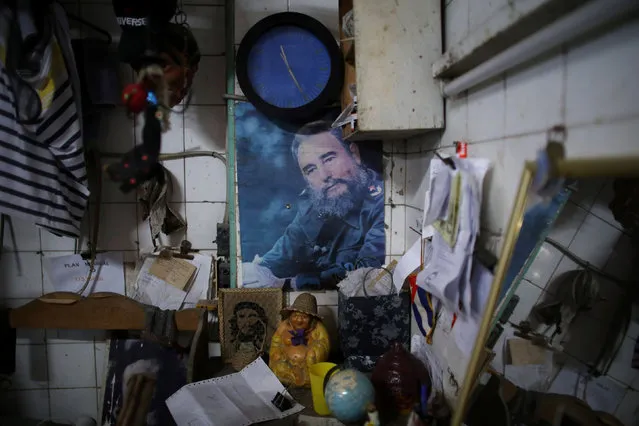 An image of late Cuban President Fidel Castro is seen at a butcher house in downtown Havana, Cuba, October 18, 2016. (Photo by Alexandre Meneghini/Reuters)
