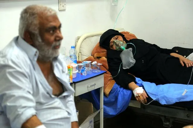 A coronavirus patient receives treatment at a hospital in Najaf, Iraq, Wednesday, July 14, 2021. (Photo by Anmar Khalil/AP Photo)