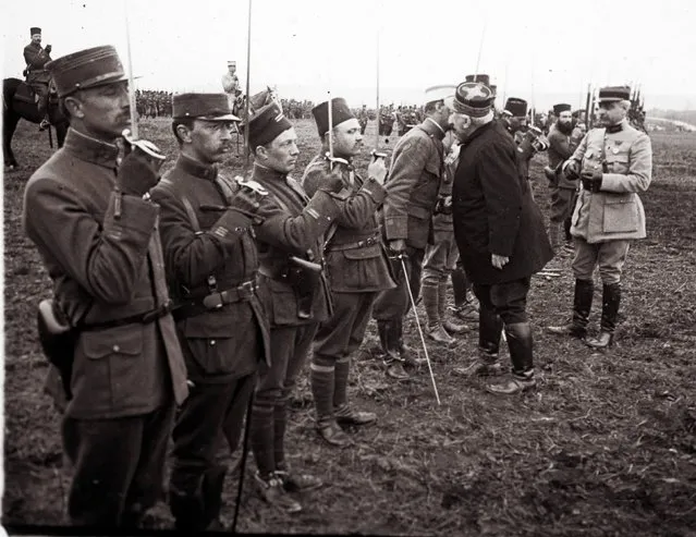 An archive picture shows French General Joseph Joffre (2ndR) congratulating and awarding medals to soldiers, who fought in the Battle of Verdun, in Verdun, France, in March 1916. A Viscount in the Armoured Cavalry Branch of the French Army left behind a collection of hundreds of glass plates taken during World War One (WWI). The images, by an unknown photographer, show the daily life of soldiers in the trenches, destruction of towns and military leaders. (Photo by Reuters/Collection Odette Carrez)