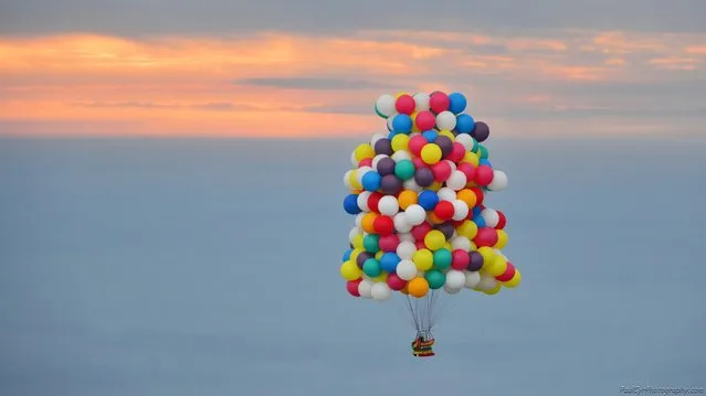 Jonathan Trappe takes to the air in his balloon cluster system on September 12, 2013 in Caribou, Maine. Balloon aviator Jonathan Trappe's attempt to cross the Atlantic using helium balloons has ended – just twelve hours into the journey. (Photo by Wiktor Skupinski/Barcroft Media)