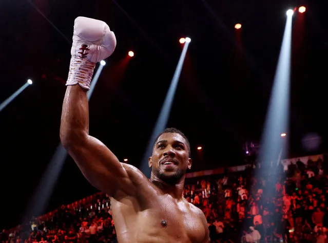 Britain's Anthony Joshua celebrates after defeating Sweden's Otto Wallin during their heavyweight boxing match at the Kingdom Arena in Riyadh on December 23, 2023. (Photo by Ahmed Yosri/Reuters)