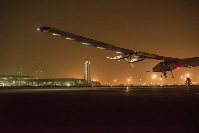 Solar Impulse 2 descends to land in Muscat, Oman, March 9, 2015. (Photo by Jean Revillard/Reuters)