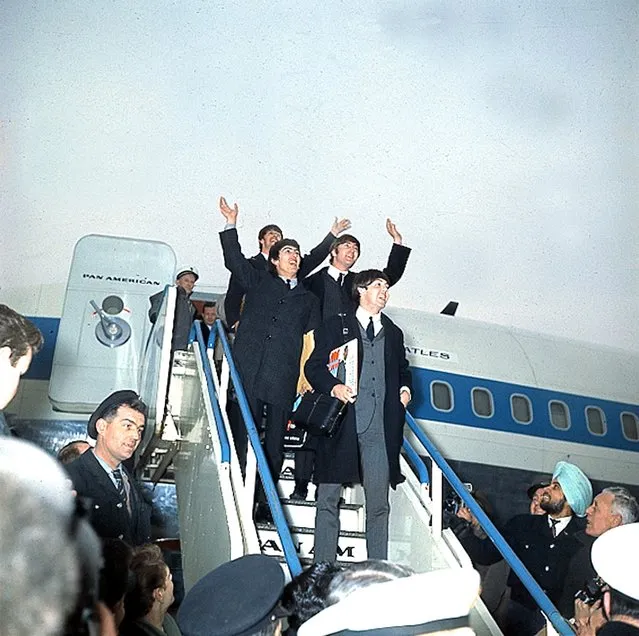 British pop group the Beatles wave as they arrive at London Airport, England, in 1964 after their successful U.S. tour. (Photo by AP Photo)