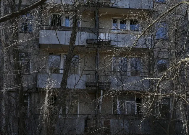 A view of the abandoned city of Pripyat is seen near the Chernobyl nuclear power plant in Ukraine on March 28, 2016. (Photo by Gleb Garanich/Reuters)