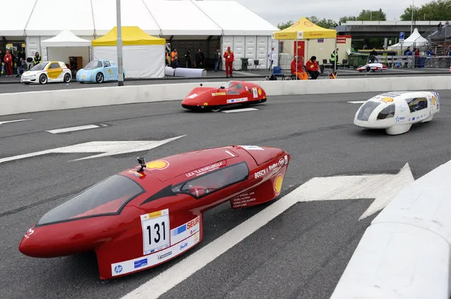 The Eco-M5, #131, The Evolution, #19, and The E-volution, #319, seen on the track during competition day two of the Shell Eco-marathon Europe 2015 in Rotterdam, Netherlands, Saturday, May 23, 2015. (Photo by Patrick Post/AP Images for Shell)