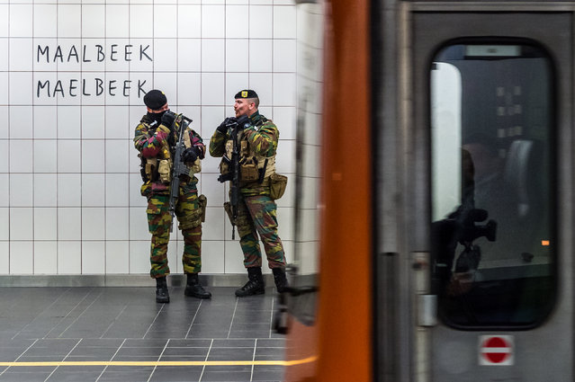 Soldiers patrol at Maelbeek metro station in Brussels on Monday April 25, 2016. For the first time since the March 22 attacks, all of the Brussels metro lines are operating a full schedule again. The Maelbeek station reopened after being closed more than a month due to the terrorist bombing that killed 16 people and wounded many more.  (Photo by Geert Vanden Wijngaert/AP Photo)