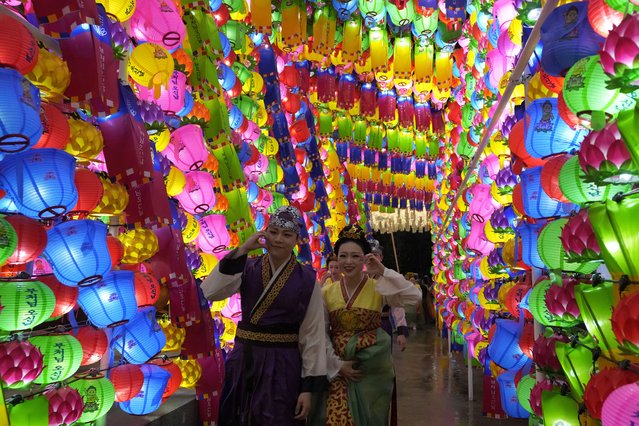 Buddhists walk past lanterns during the Lotus Lantern Festival, ahead of the birthday of Buddha at Dongguk University in Seoul, South Korea, Saturday, May 11, 2024. (Photo by Ahn Young-joon/AP Photo)