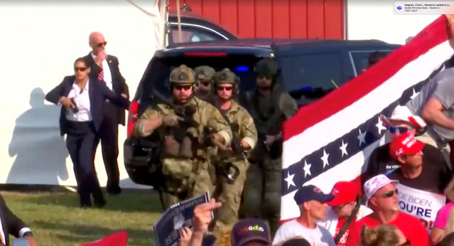 Security forces members operate at the site where Republican presidential candidate and former President Donald Trump was attending a campaign event where gunfire rang out, at the Butler Farm Show in Butler, Pennsylvania, on July 13, in this screen grab taken from a video. (Photo by Reuters TV)