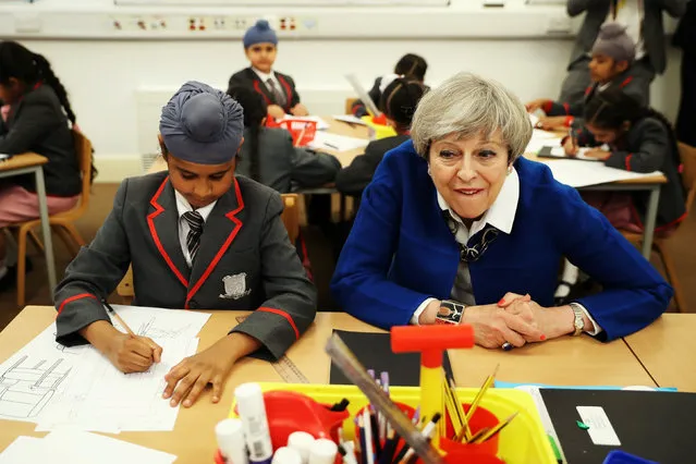 Britain's Prime Minister Theresa May meets the Nishkam Trust leadership team and pupils of Nishkam Primary School in Birmingham, May 16, 2017. (Photo by Dan Kitwood/Reuters)