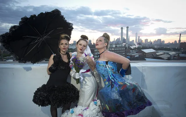 Models take part in the “Trashion” fashion show on the roof of a building in the Brooklyn Navy Yard in the Brooklyn borough of New York May 31, 2014. The show featured designers who used recycled items such as coffee filters, tissue paper, grain sacks and window screens. (Photo by Carlo Allegri/Reuters)