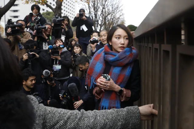 Freelance journalist Shiori Ito looks away while talking to reporters outside a courthouse Wednesday, December 18, 2019, in Tokyo. A Tokyo court awarded compensation to Ito in a high-profile rape case which prosecutors had once dropped their criminal investigation into an alleged attacker known for his close ties with Prime Minister Shinzo Abe and his ultra-conservative supporters. (Photo by Jae C. Hong/AP Photo)