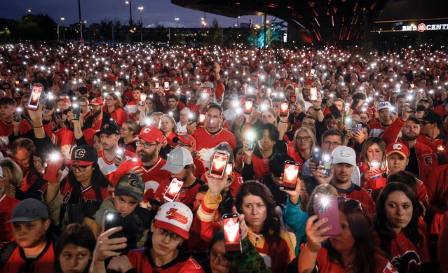 The American ice hockey players Johnny and Matthew Gaudreau died last Thursday when they were struck by a car while riding bicycles near their home in New Jersey. Fans remembered the brothers at a vigil in the Canadian city of Calgary on September 4, 2024. (Photo by Jeff McIntosh/The Canadian Press/AP Photo)