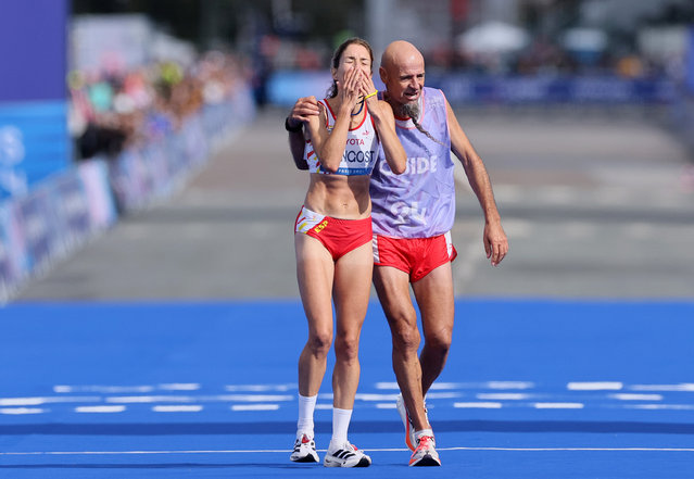 Elena Congost of Team Spain celebrates finishing third and taking the Bronze Medal with her guide Mia Carol Bruguera during the Women's T12 Marathon on day eleven of the Paris 2024 Summer Paralympic Games at on September 08, 2024 in Paris, France. (Photo by Andy Lyons/Getty Images)