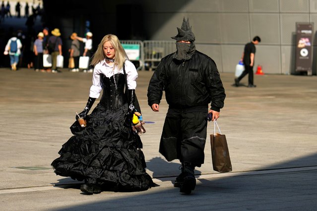 Visitors outside the venue for Seoul fashion week in Seoul, South Korea on September 3, 2024. (Photo by Lee Jin-man/AP Photo)