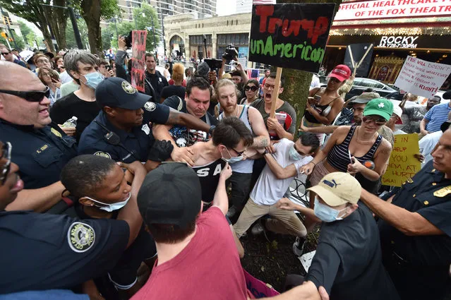 Atlanta police move in to arrest multiple protestors outside a Donald Trump rally at the Fox Theater Wednesday, June 15, 2016, in Atlanta. (Photo by Brant Sanderlin/Atlanta Journal-Constitution via AP Photo)