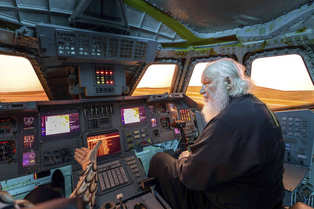 In this photo released by Russian Orthodox Church Press Service on Sunday, September 29, 2024, Patriarch Kirill, the head of the Russian Orthodox Church, sits in the flight simulator of the Soviet-designed Buran space shuttle during a visit to the Sirius Art and Science Park, Krasnodar region of Russia. (Photo by Oleg Varov, Russian Orthodox Church Press Service via AP Photo)