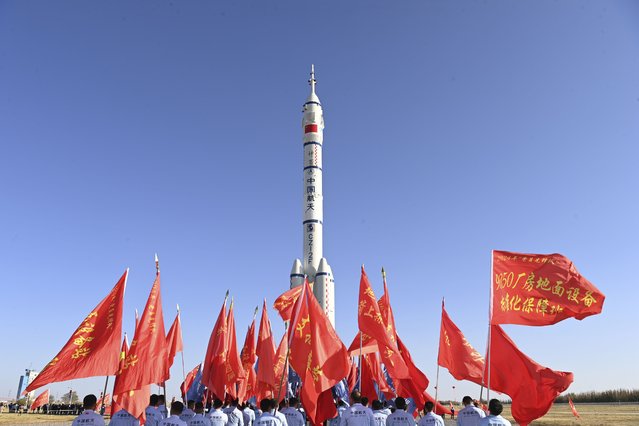 In this photo released by Xinhua News Agency, a combination of the Shenzhou-19 spaceship ontop of a Long March-2F carrier rocket is transported to the launch area in Jiuquan in northwestern China, on Tuesday, October 22, 2024. (Photo by Wang Jiangbo/Xinhua via AP Photo)