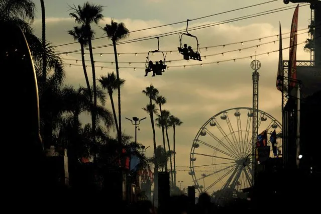 People attend the San Diego County Fair, as Americans prepare for their annual 4th of July holiday, in Del Mar, California, U.S., June 29, 2022. (Photo by Mike Blake/Reuters)