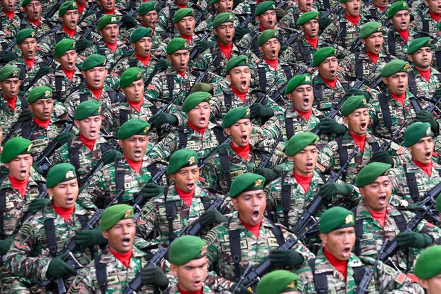 Army personnel march during celebrations to mark the 79th anniversary of the Indonesian Armed Forces (TNI) in Banda Aceh on October 5, 2024. (Photo by Chaideer Mahyuddin/AFP Photo)