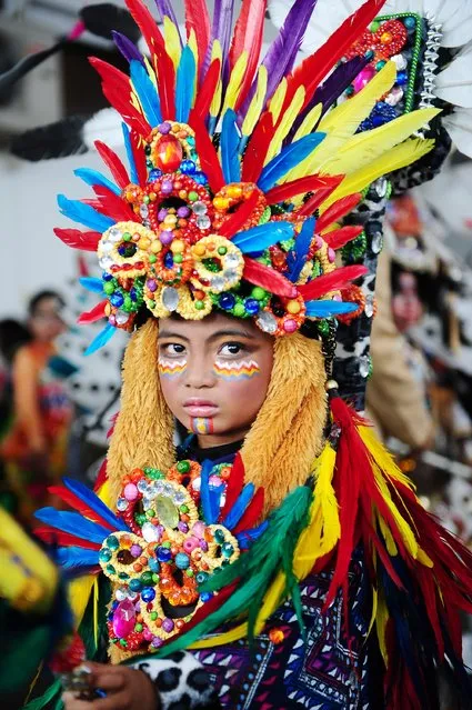 A model wears an Apache costume in the kids carnival during The 13th Jember Fashion Carnival 2014 on August 21, 2014 in Jember, Indonesia. (Photo by Robertus Pudyanto/Getty Images)