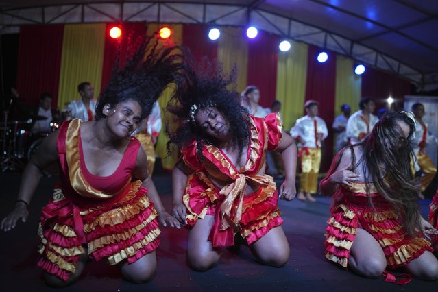 Members of the Paraguay-African cultural group Kamba Cua dance in honor of Saint Balthazar, one of the Three Kings, as they celebrate the upcoming holiday of Epiphany in San Lorenzo on the outskirts of Asuncion, Paraguay, Sunday, January 5, 2025.(Photo by Jorge Saenz/AP Photo)