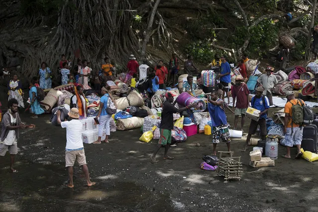 In this October 2, 2017, photo provided by the International Red Cross, residents prepare to evacuate from Ambae Island in Vanuatu amid fears of a volcanic eruption. (Photo by Joe Cropp/International Red Cross via AP Photo)