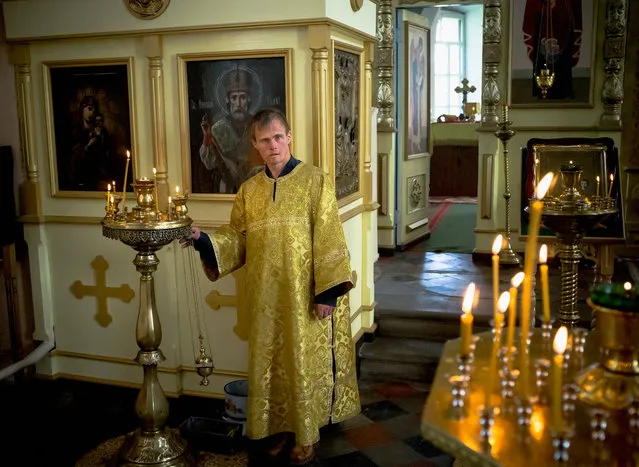 A patient works as an assistant priest in the village church. (Photo by Anastasia Rudenko)