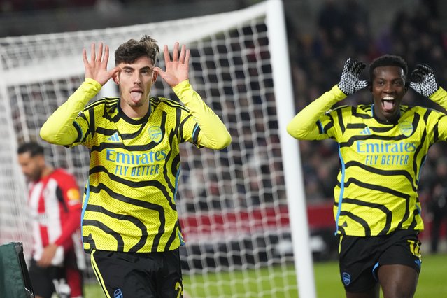 Arsenal's Kai Havertz, left, celebrates after scoring his side's opening goal during the English Premier League soccer match between Brentford and Arsenal at the Gtech Community stadium in London, Saturday, November 25, 2023. (Photo by Kirsty Wigglesworth/AP Photo)
